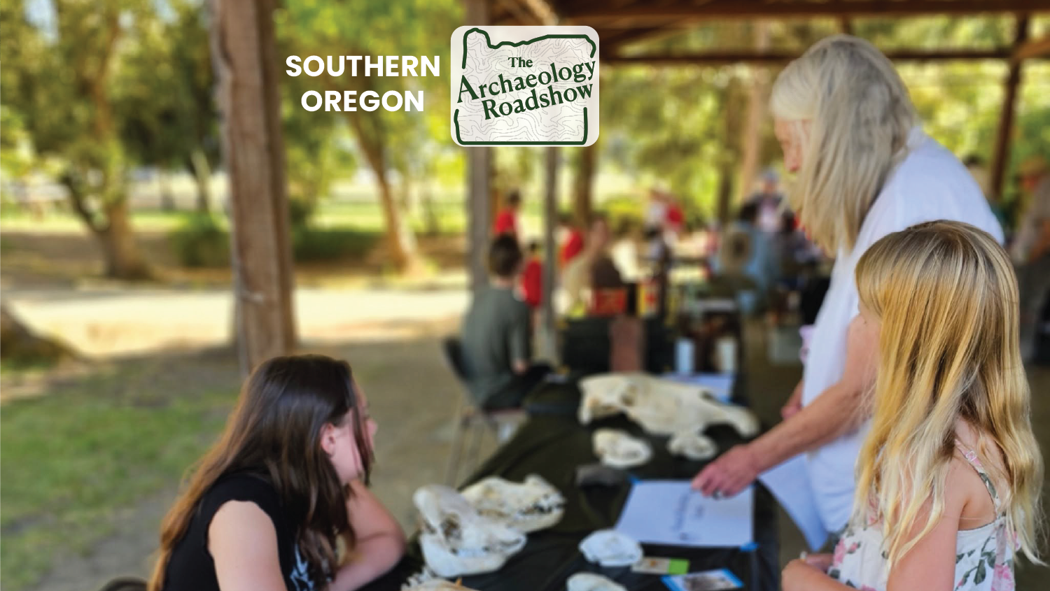 Photo of a family perusing photos and skulls at an outdoor exhibit with the overlay of the logo for Souther Oregon Archaeology Roadshow